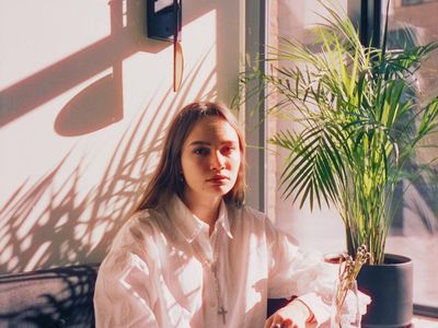 A calm corner with a plant and natural light.