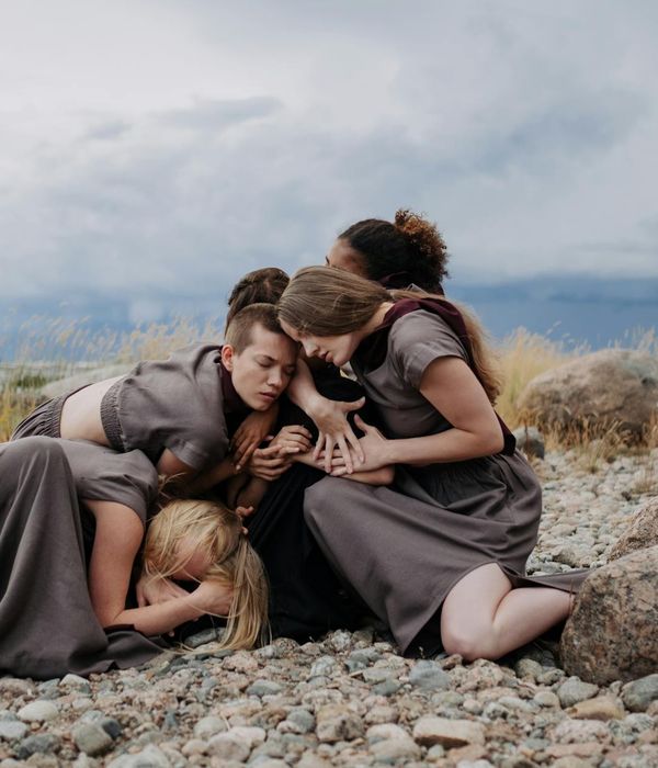 Woman performing a fluid yoga movement in a calm setting.
